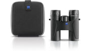 A black pair of binoculars and a black carrying case on a white background