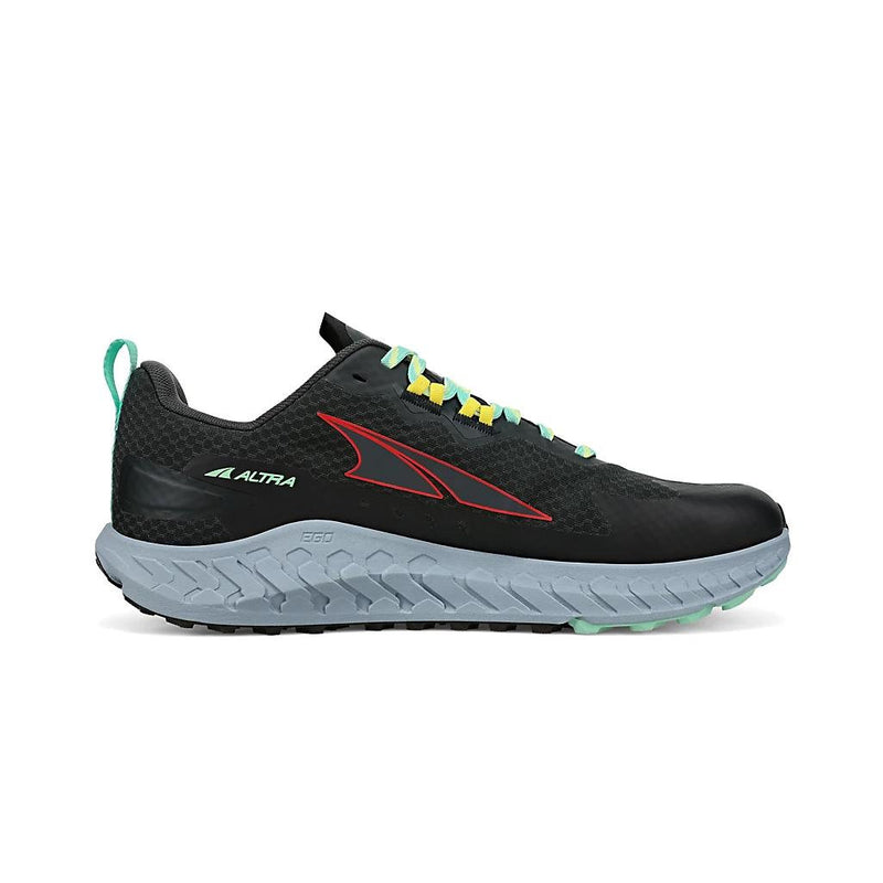 A black running shoe with teal laces and a gray bottom on a white background