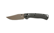 Folding knife with a brown blade and black handle on a white background