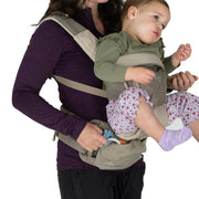Woman carrying a child in a baby carrier on a white background