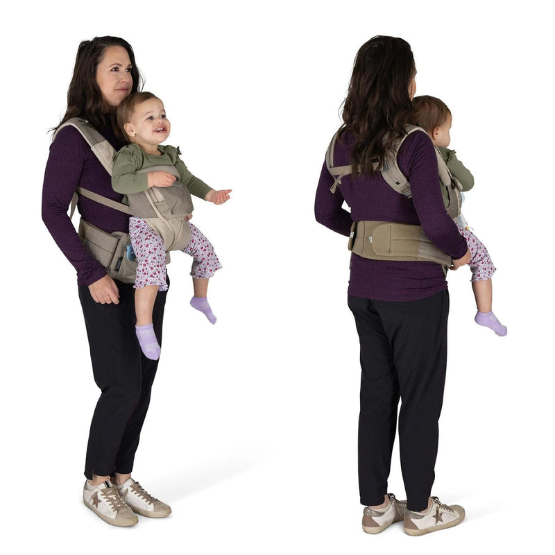 Two women wearing baby carriers with children on a white background