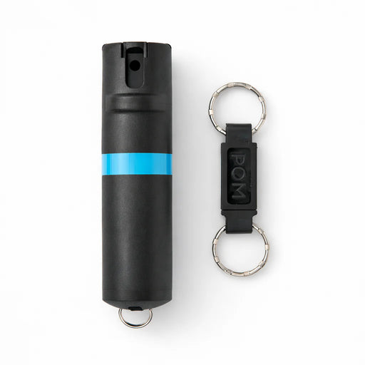 A black pepper spray container with a black keychain on a white background