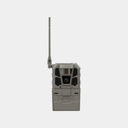 A gray trail camera with an attached vertical antenna, shown from the front against a light gray background.
