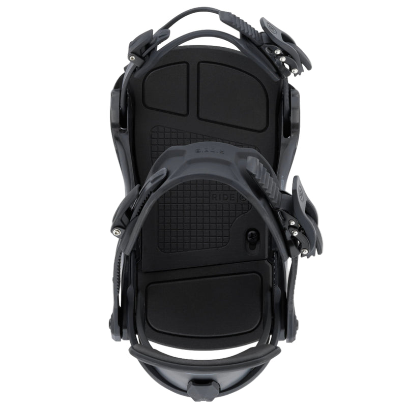 Black snowboard bindings on a white background