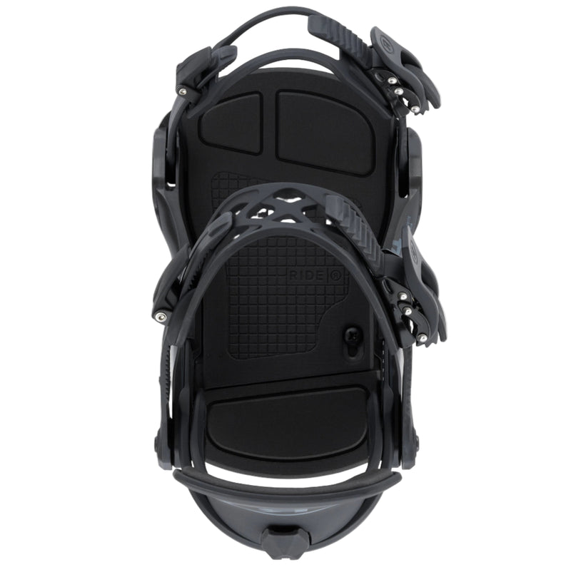 Black snowboard bindings on a white background