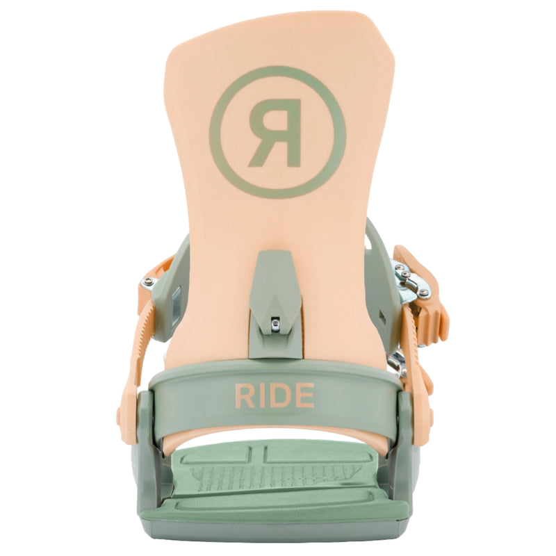 Close-up of a peach and green snowboard binding with 'RIDE' branding on a white background