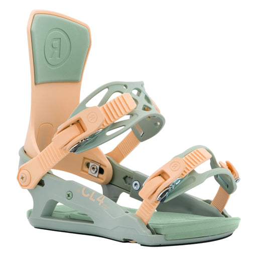 Green and peach snowboard bindings on a white background