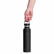 Black water bottle held by a hand on a white background