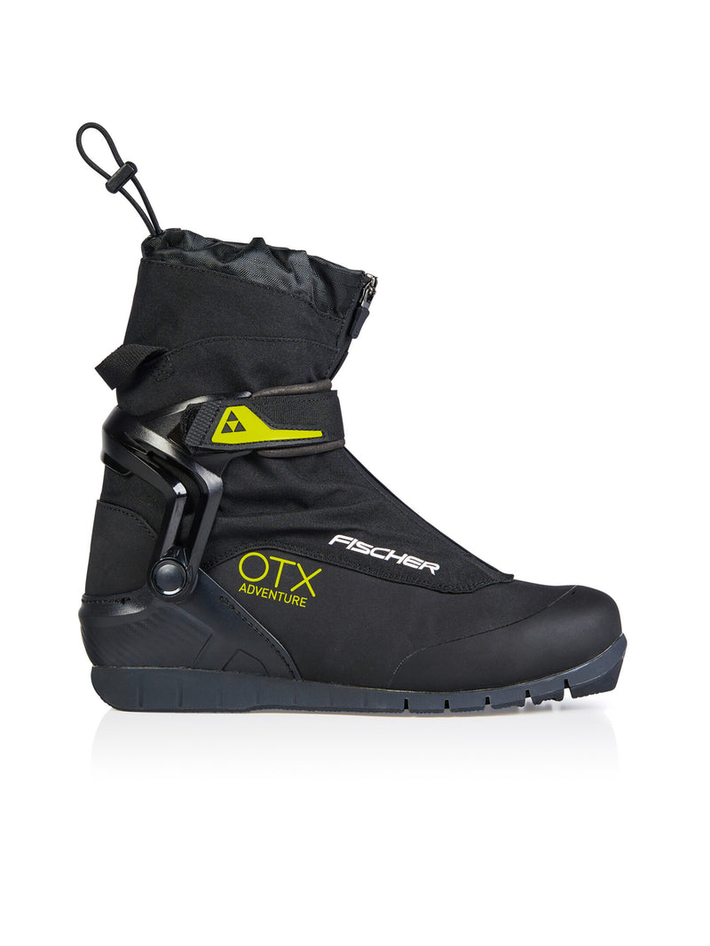 Side view of a black ski boot with yellow accents against a white background. 