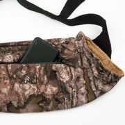 Camouflage-patterned bag with a black phone inside on a white background