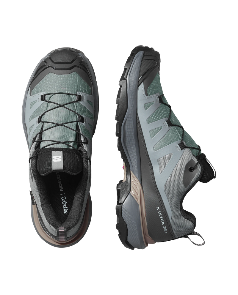 Pair of gray hiking shoes with brand logo on a white background