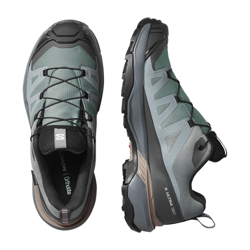 Pair of gray hiking shoes with brand logo on a white background