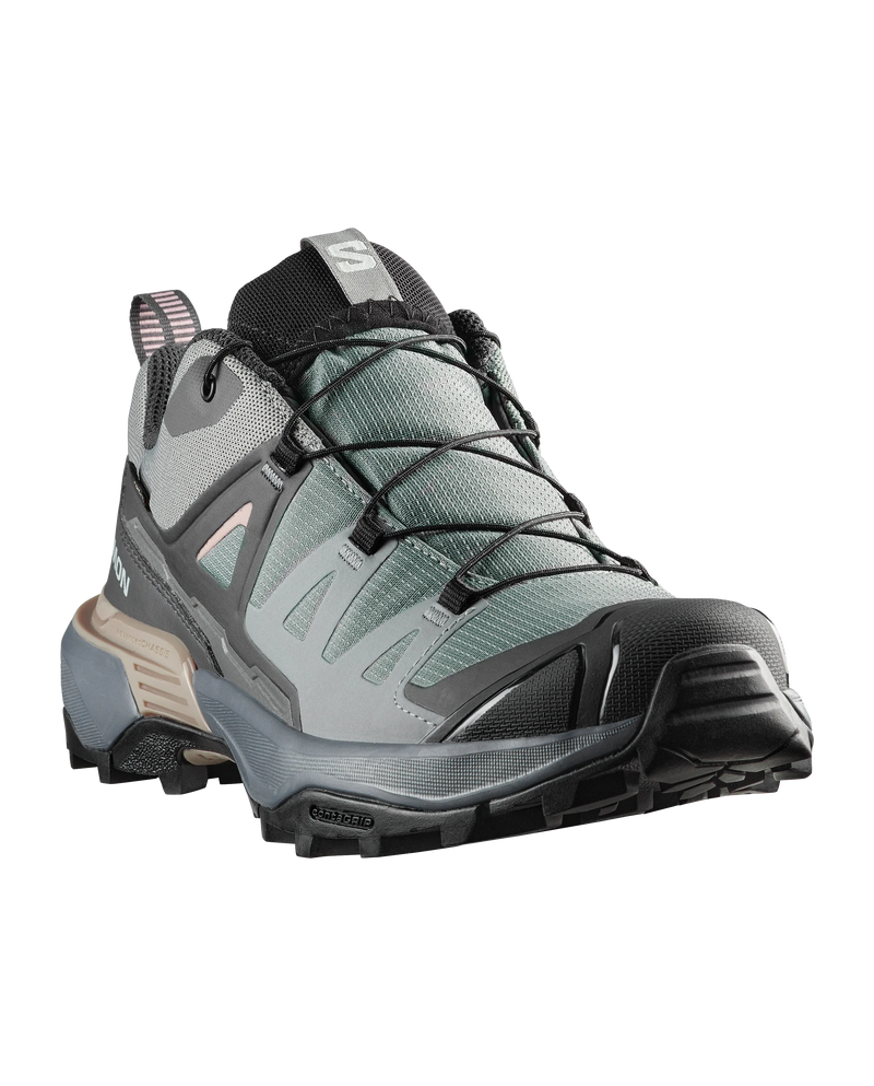 Gray hiking boot with black sole on a white background