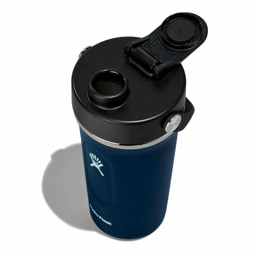 Top view of a blue Hydro Flask bottle with it's lid open against a white background. 