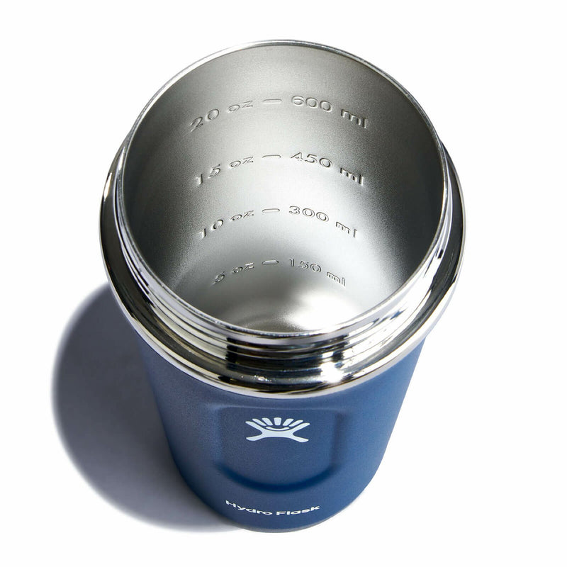 Top view showcasing the inside of a blue colored Hydro Flask bottle against a white background. 