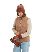 Woman wearing a brown vest, beanie, and gloves on a white background