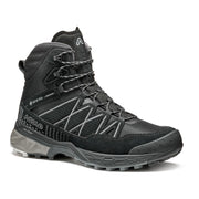 Side view of a black winter boot with grey accents against a white background. 