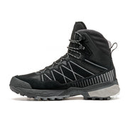 Side view of a black winter boot against a white background. 
