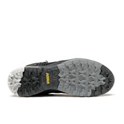 Bottom view showcasing the black and grey tread of a winter boot against a white background.