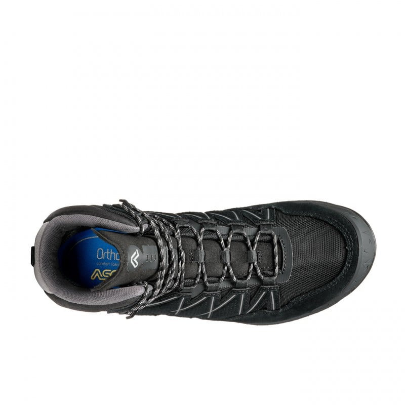 Top view of a black winter boot against a white background. 
