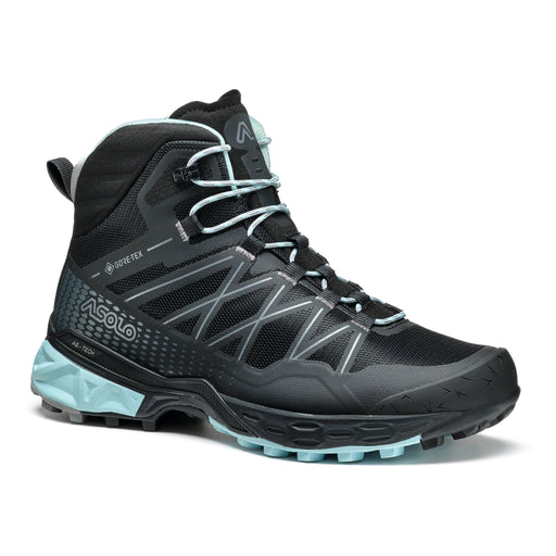 Side view of a black and light blue colored boot against a white background. 