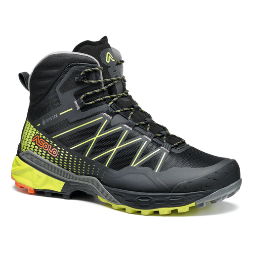 Side view of a black and lime green colored boot against a white background. 