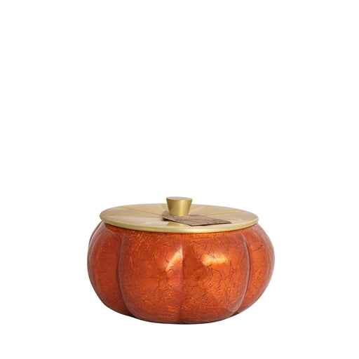 Pumpkin-shaped container with a gold lid on a white background