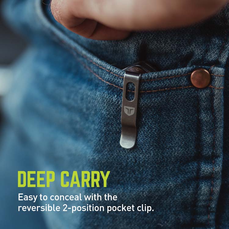 Close-up of a denim pocket with a pocket clip and text about concealability.