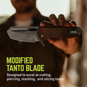 Hand holding a modified tanto blade with text describing its capabilities.