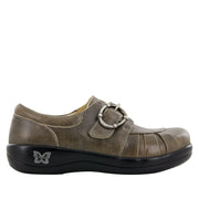 Brown shoe with a buckle on a white background