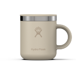 Small tan travel mug with a Hydroflask logo on it on a white background.