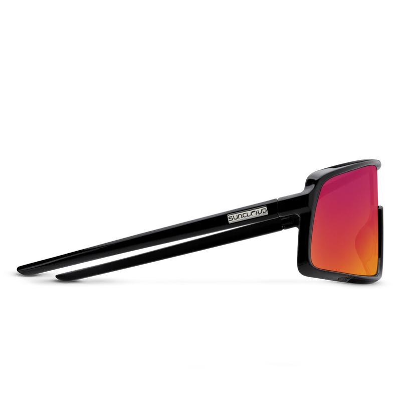 The side view of a pair of black glasses with red lenses on a white background