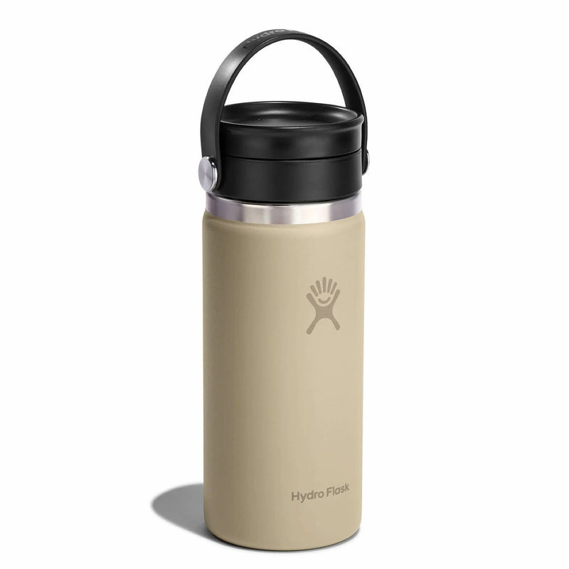 Beige Hydro Flask coffee bottle with black lid on a white background