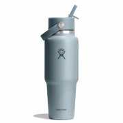 A matte slate blue Hydro Flask insulated water bottle with a matching blue lid and straw, shown on a clean white background.