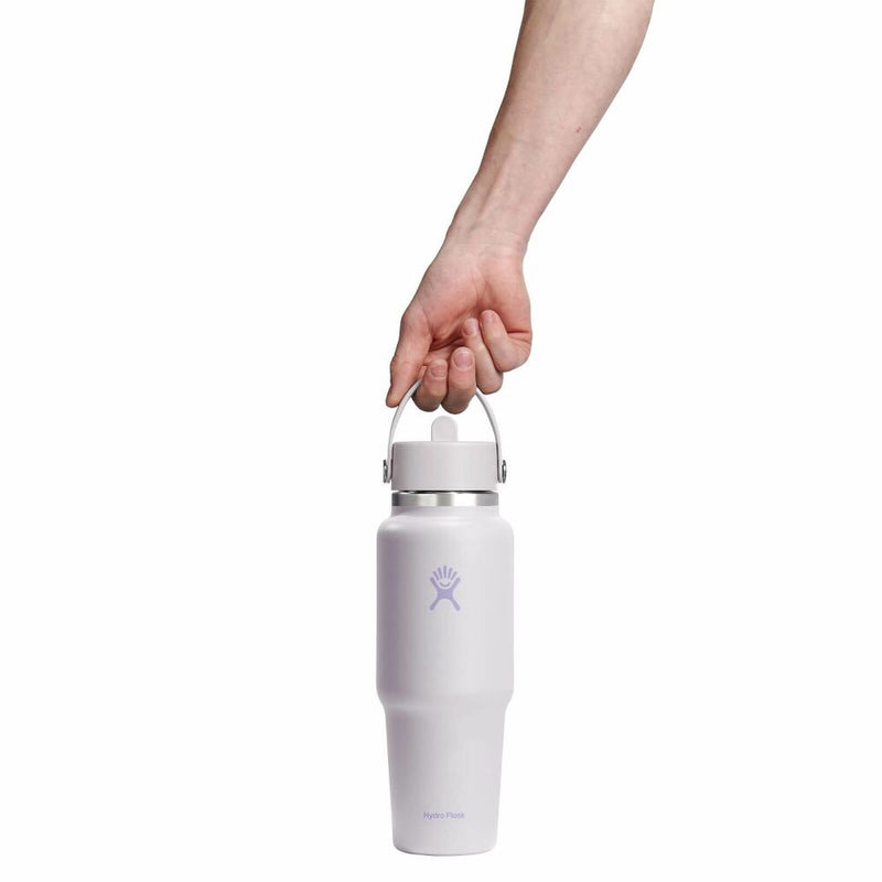 White water bottle with a handle held by a hand on a white background