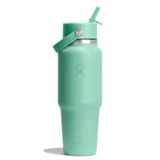 Mint green water bottle with straw lid on a white background