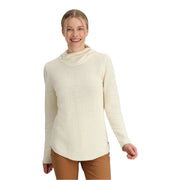 Woman wearing a cream-colored long-sleeve top on a white background