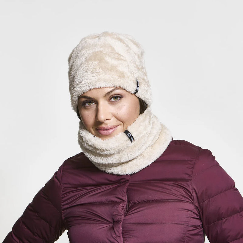Woman wearing a white fuzzy neck tube against a white background. 